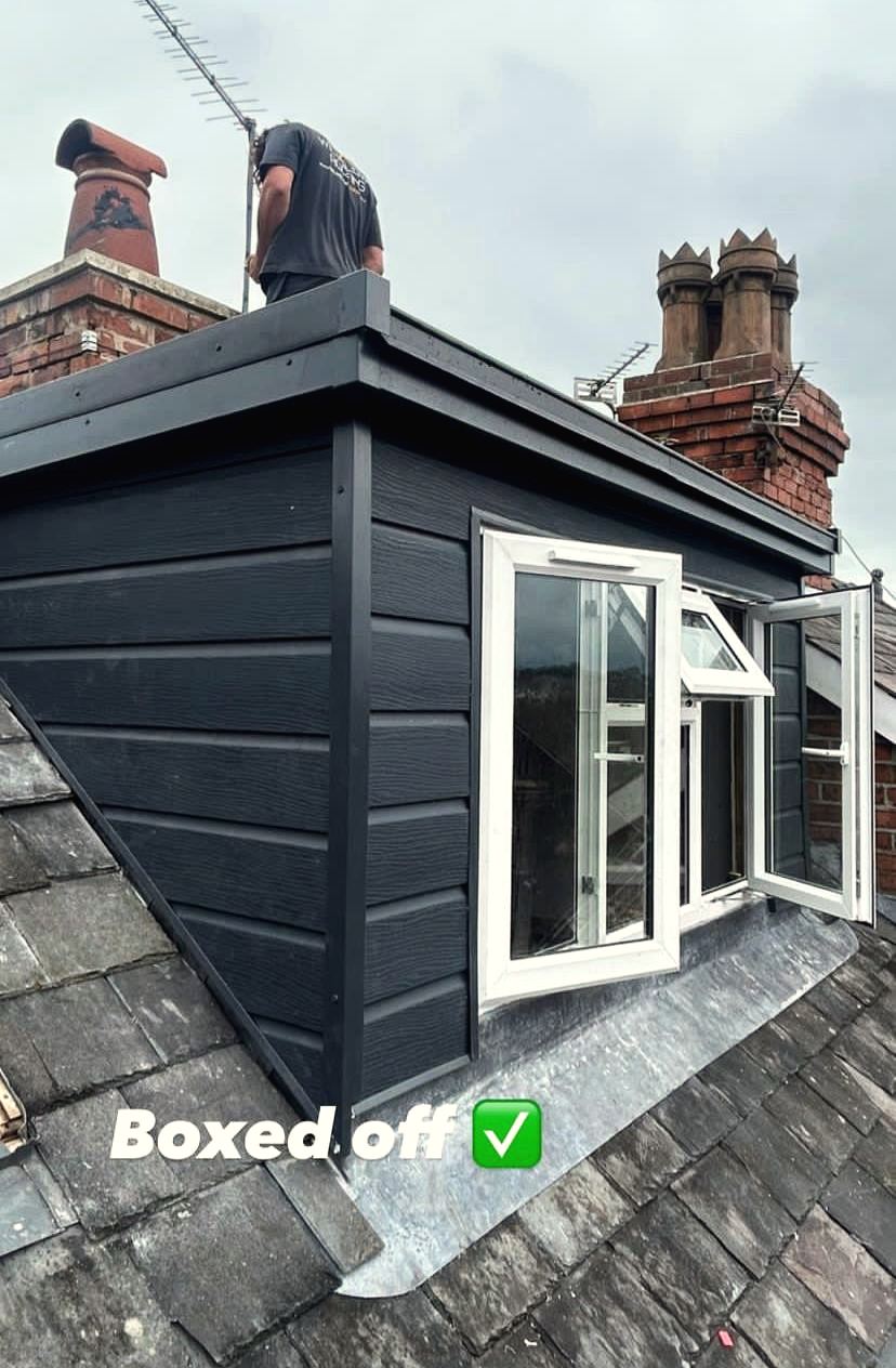 Clad dormer with new windows boxed off and watertight