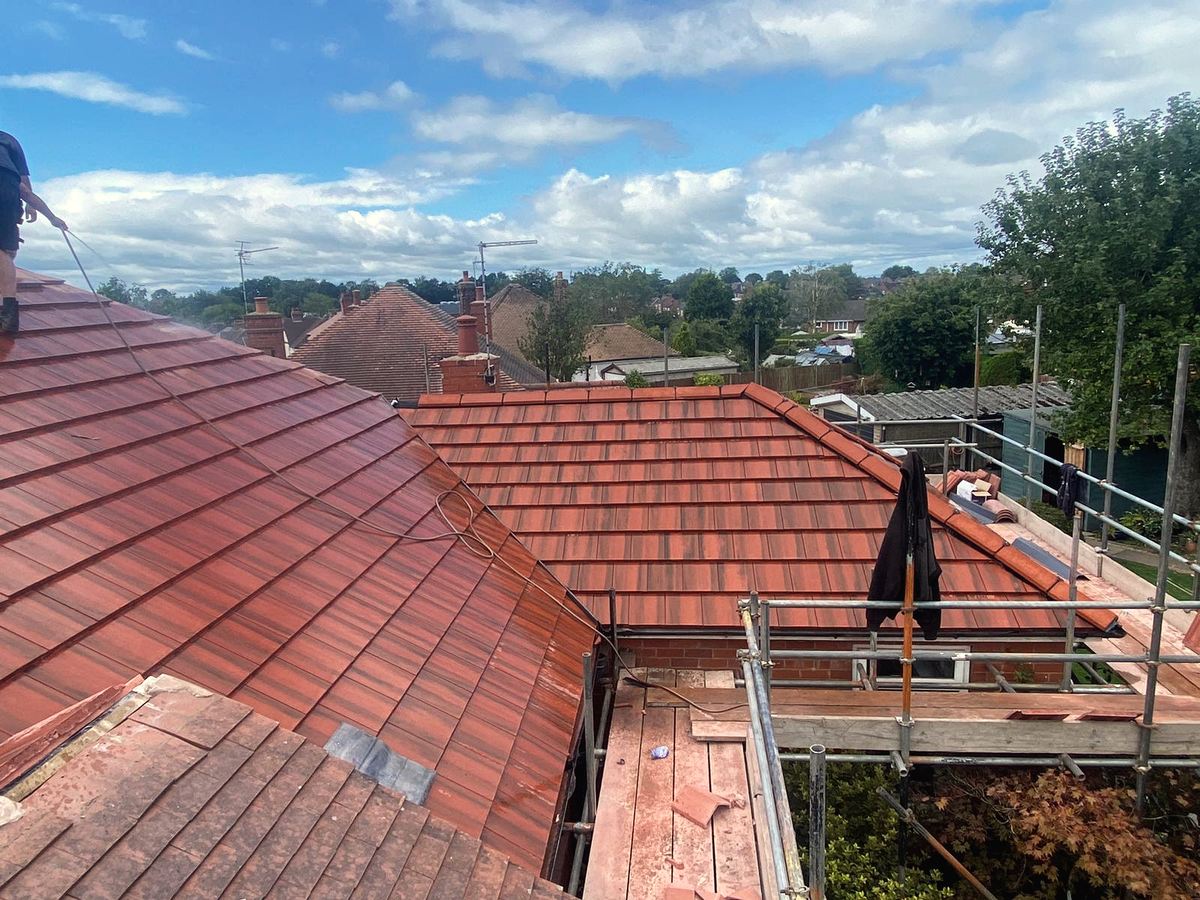 Red tile roofs across a Cheshire rooftops view