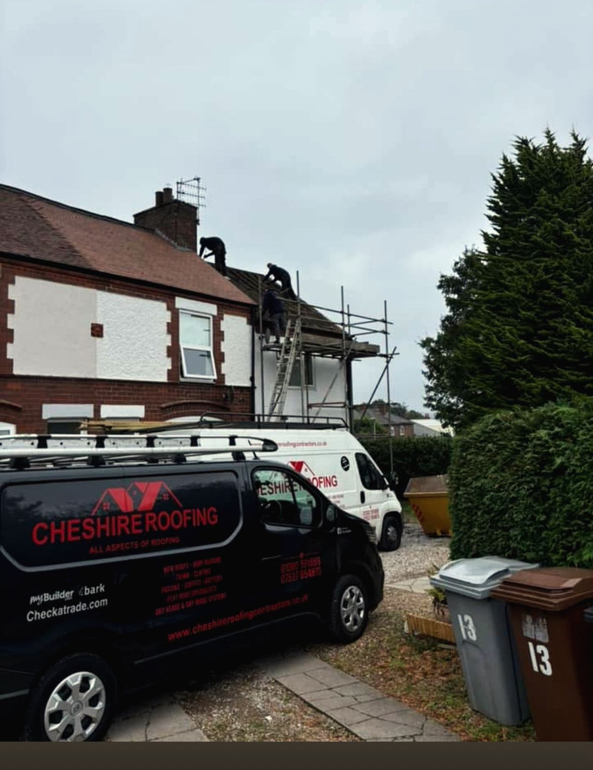 Black Cheshire Roofing Contractors van parked outside a home during roofing work